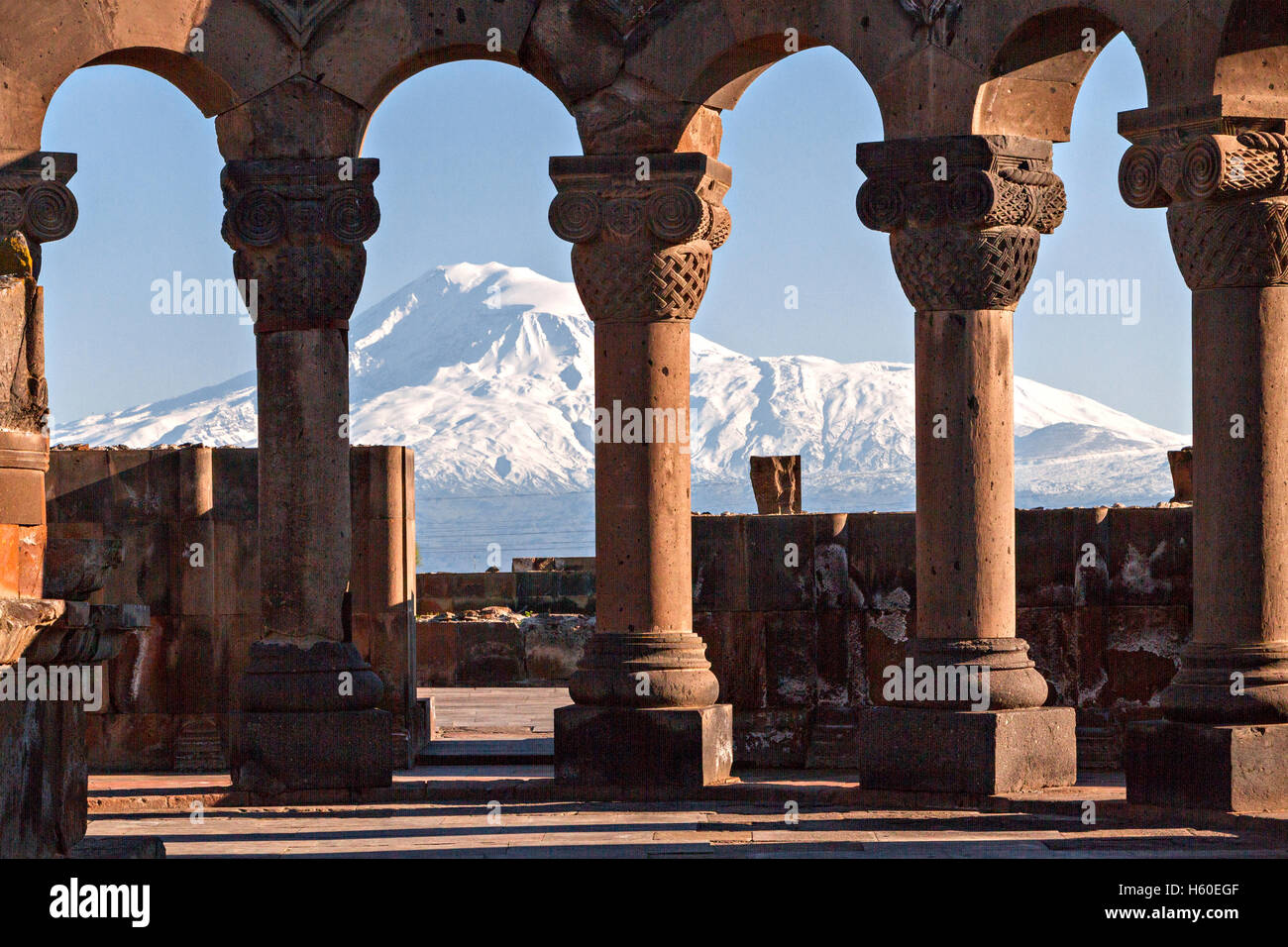 Columns of the Zvartnots Temple in Yerevan, Armenia and the Mount Ararat in the background. Stock Photo