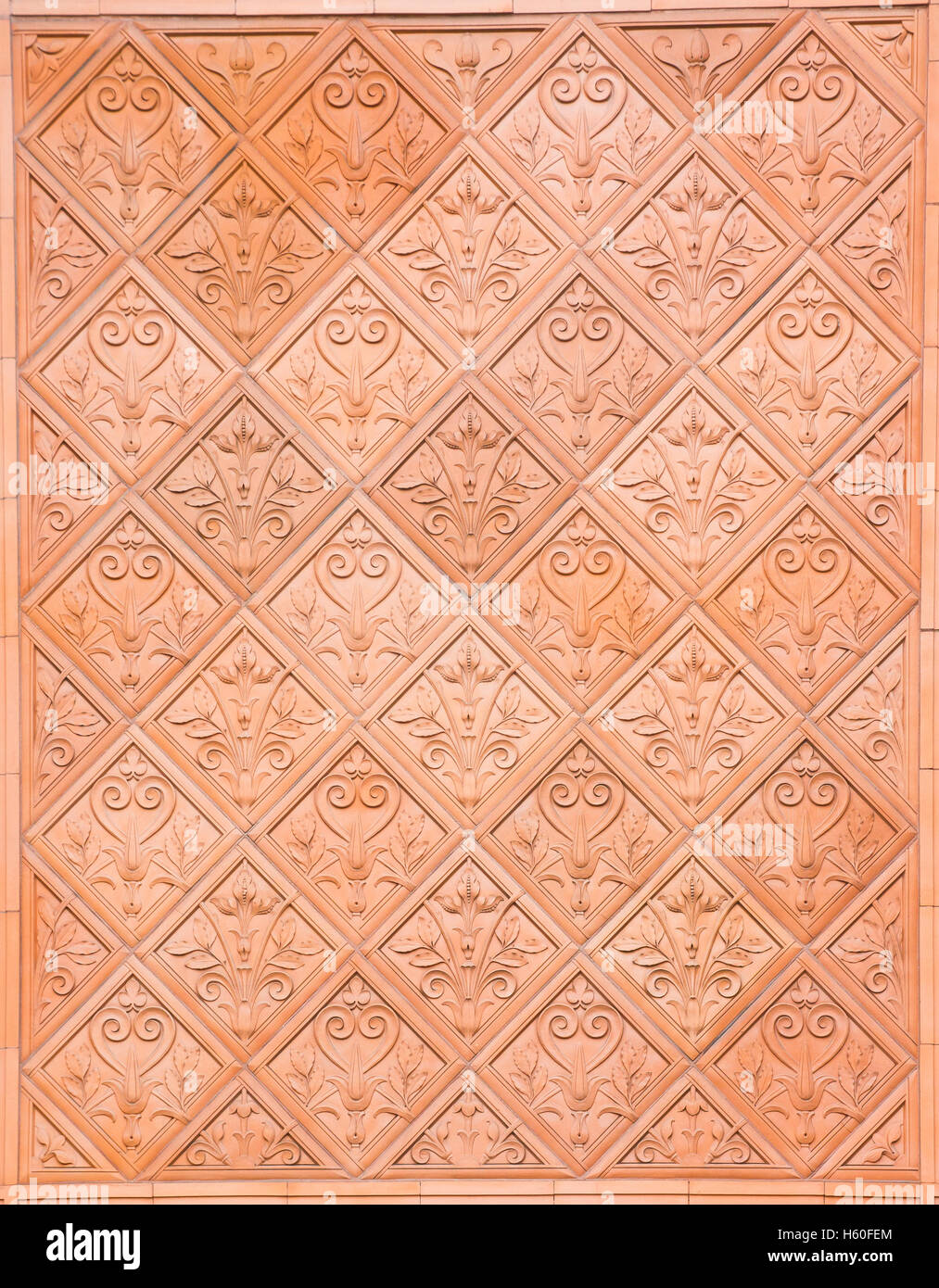 Closeup of terracotta stone with a repeating pattern Stock Photo