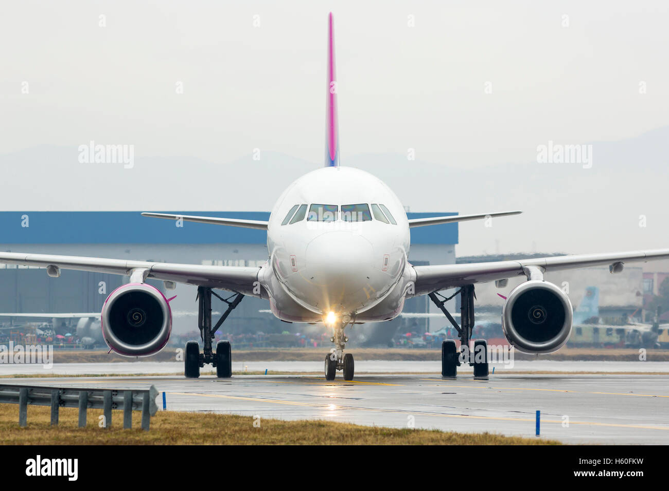 Airplane on the runway after landing at the airport. Stock Photo