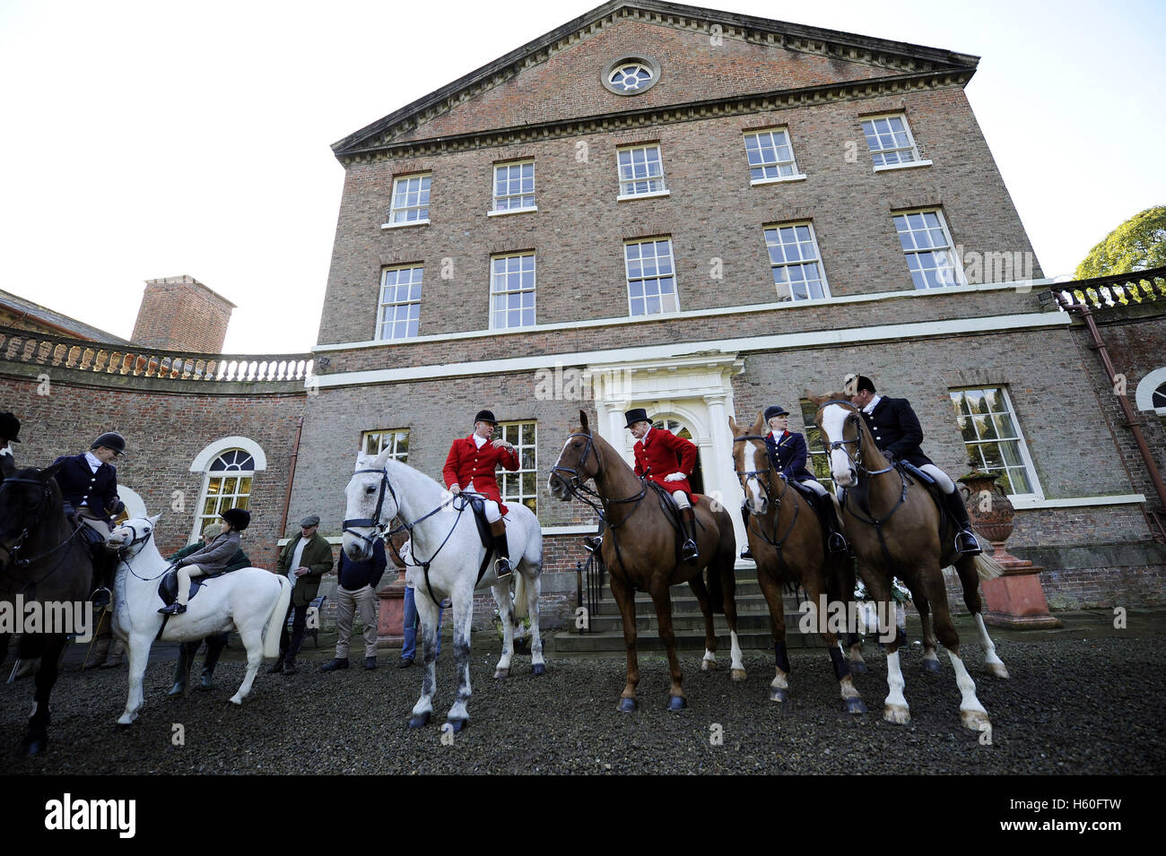 Members of the York and Ainsty Hunt gather at Sutton Hall in North Yorkshire, the home of Sir Reginald Sheffield the father-in-law of former prime minister David Cameron, on the first day of the new hunting season. Stock Photo