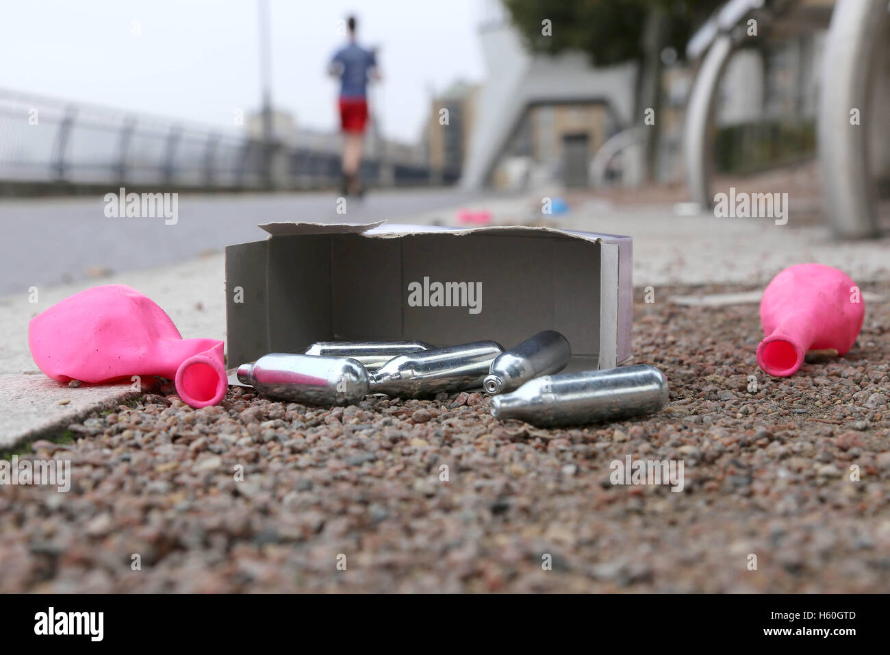 Nitrous Oxide canisters, balloons and boxes litter the Thames Path after youths spend the night