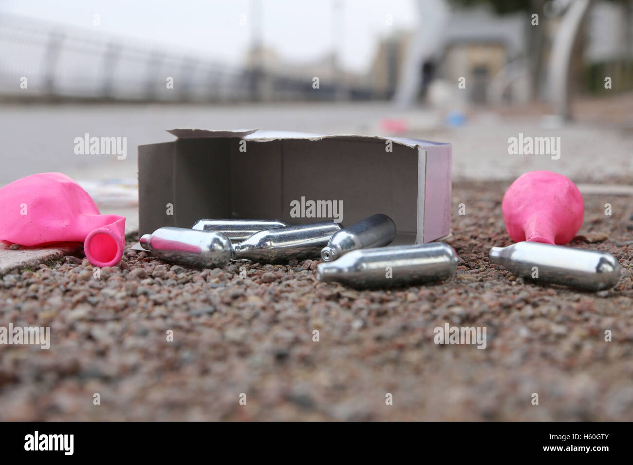 Nitrous Oxide canisters, balloons and boxes litter the Thames Path after youths spend the night