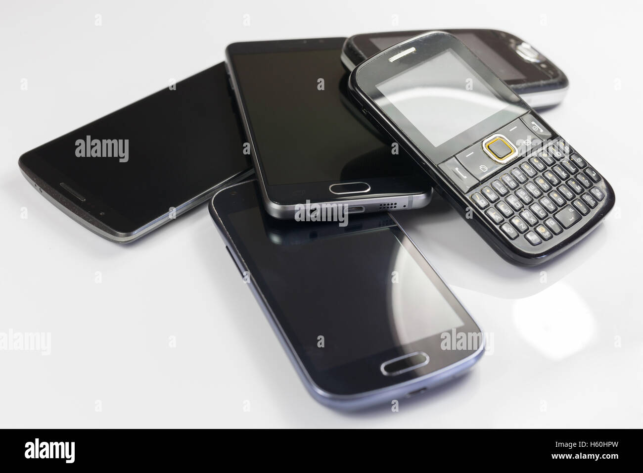 Pile of new and old mobile phones Stock Photo