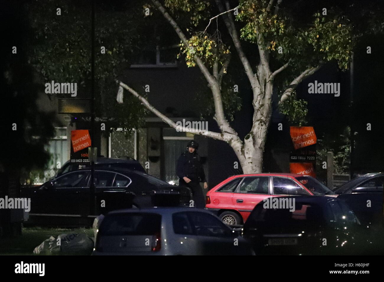 Police at the scene on Lancaster Road, Northolt, London, as police are in a stand-off with a man after receiving reports that he is in possession of dangerous items. Stock Photo