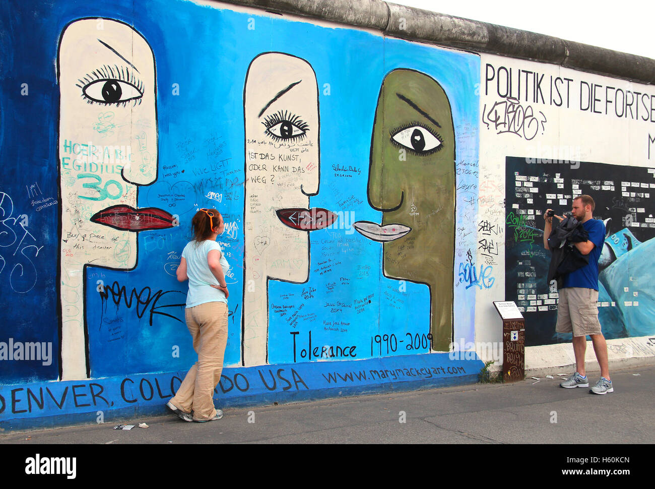 People taking pictures at the East Side Gallery, the largest outdoor