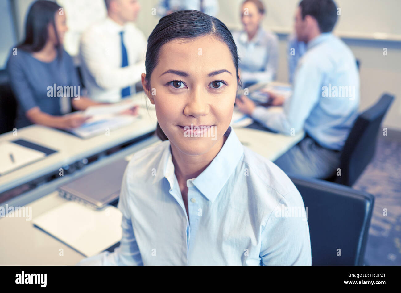 group of smiling businesspeople meeting in office Stock Photo - Alamy