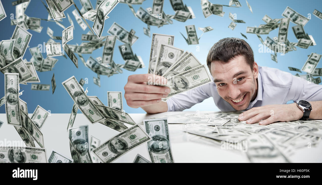 happy businessman with heap of money Stock Photo - Alamy