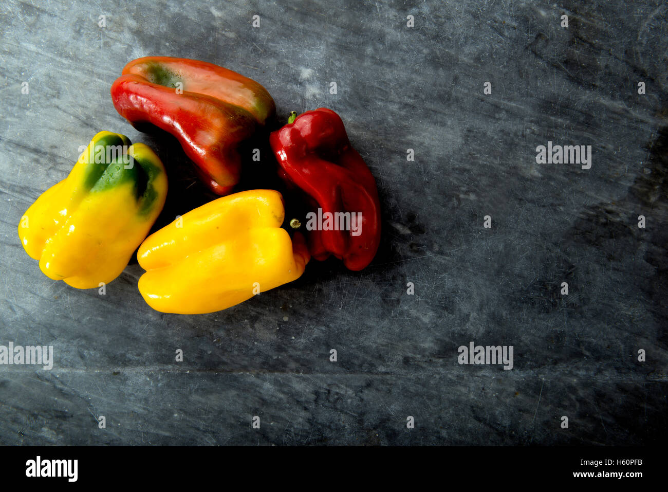 fresh vegetables on  black marble view from above in a Rembrandt light with copyspace Stock Photo
