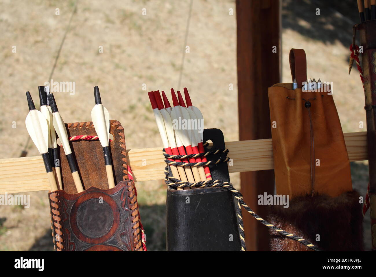 Colored feathers for arrows in a quiver Stock Photo - Alamy