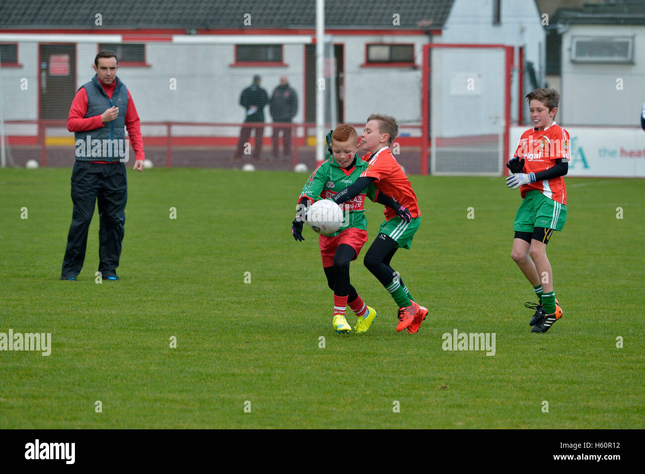 Children playing GAA Gaelic Athletic Association football in Celtic Park, Derry. Stock Photo