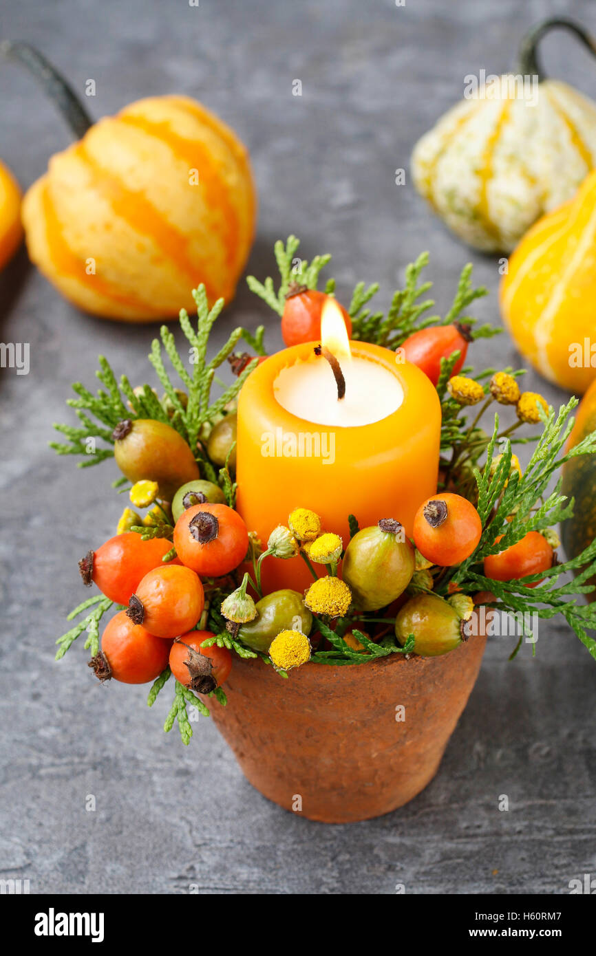 Beautiful decoration with candle and autumn plants. Table decor Stock ...