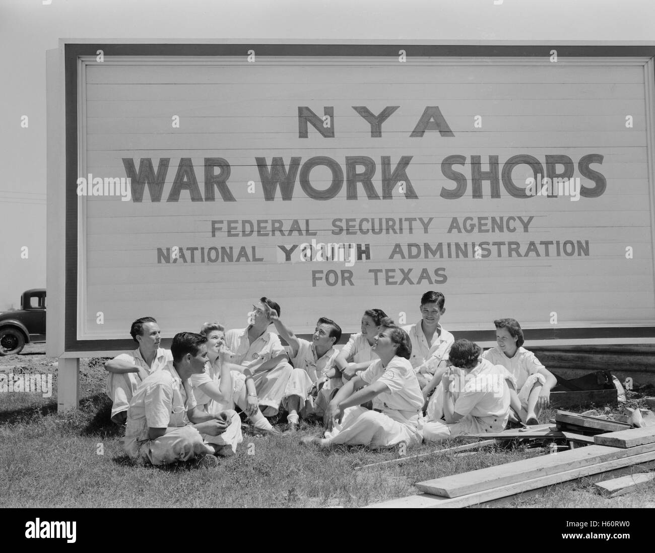 National Youth Administration (NYA) Trainees for War Jobs watching U.S. Navy Planes they are learning to service at U.S. Naval Air Base, Corpus Christi, Texas, USA, Howard R. Hollem, U.S. Office of War Information, August 1942 Stock Photo