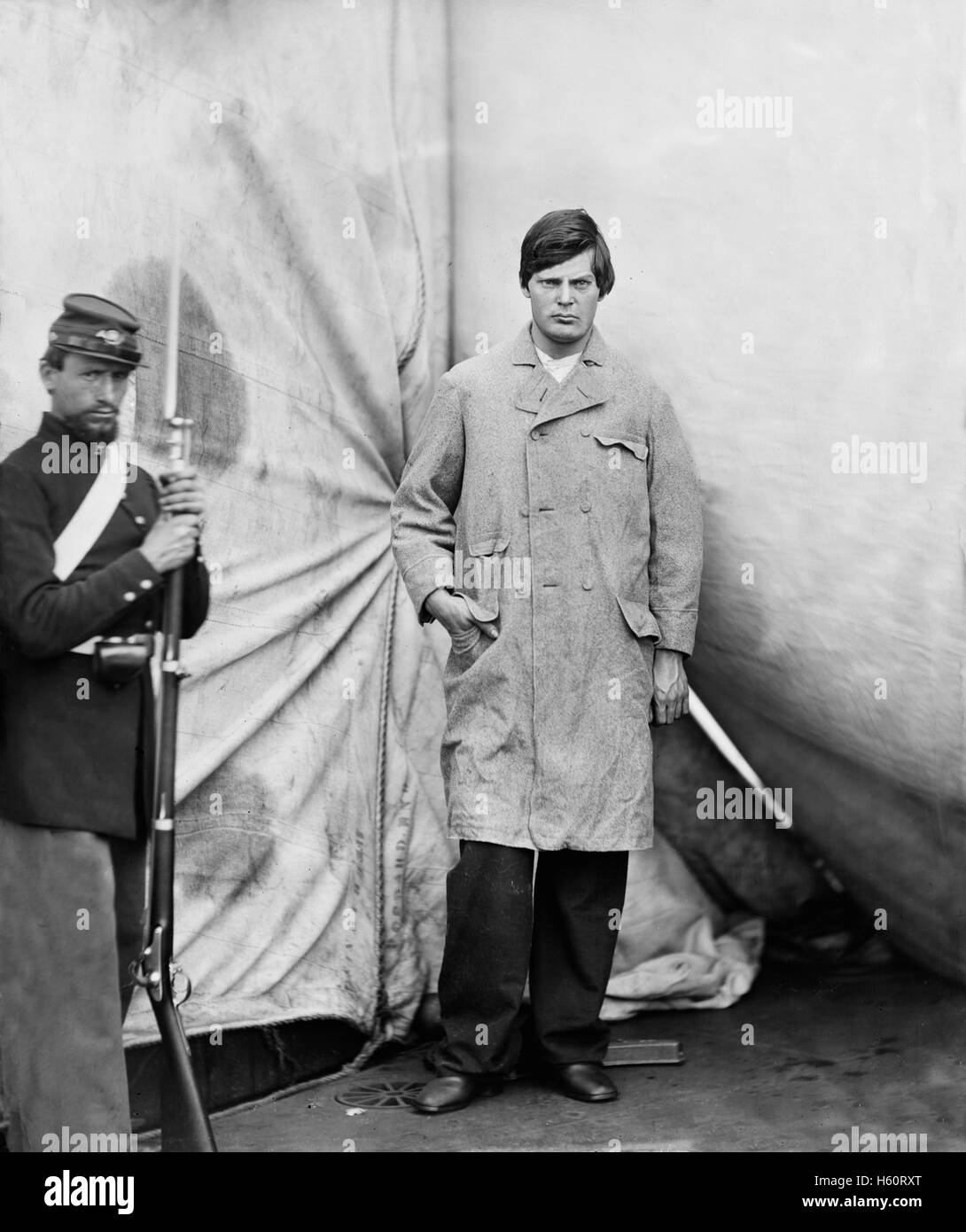Lewis Powell, also known as Lewis Payne, Attacker of U.S. Secretary of State William H. Seward, and Conspirator in Assassination of U.S. President Abraham Lincoln, Standing in Overcoat, Washington Navy Yard, Washington DC, USA, by Alexander Gardner, April 1865 Stock Photo