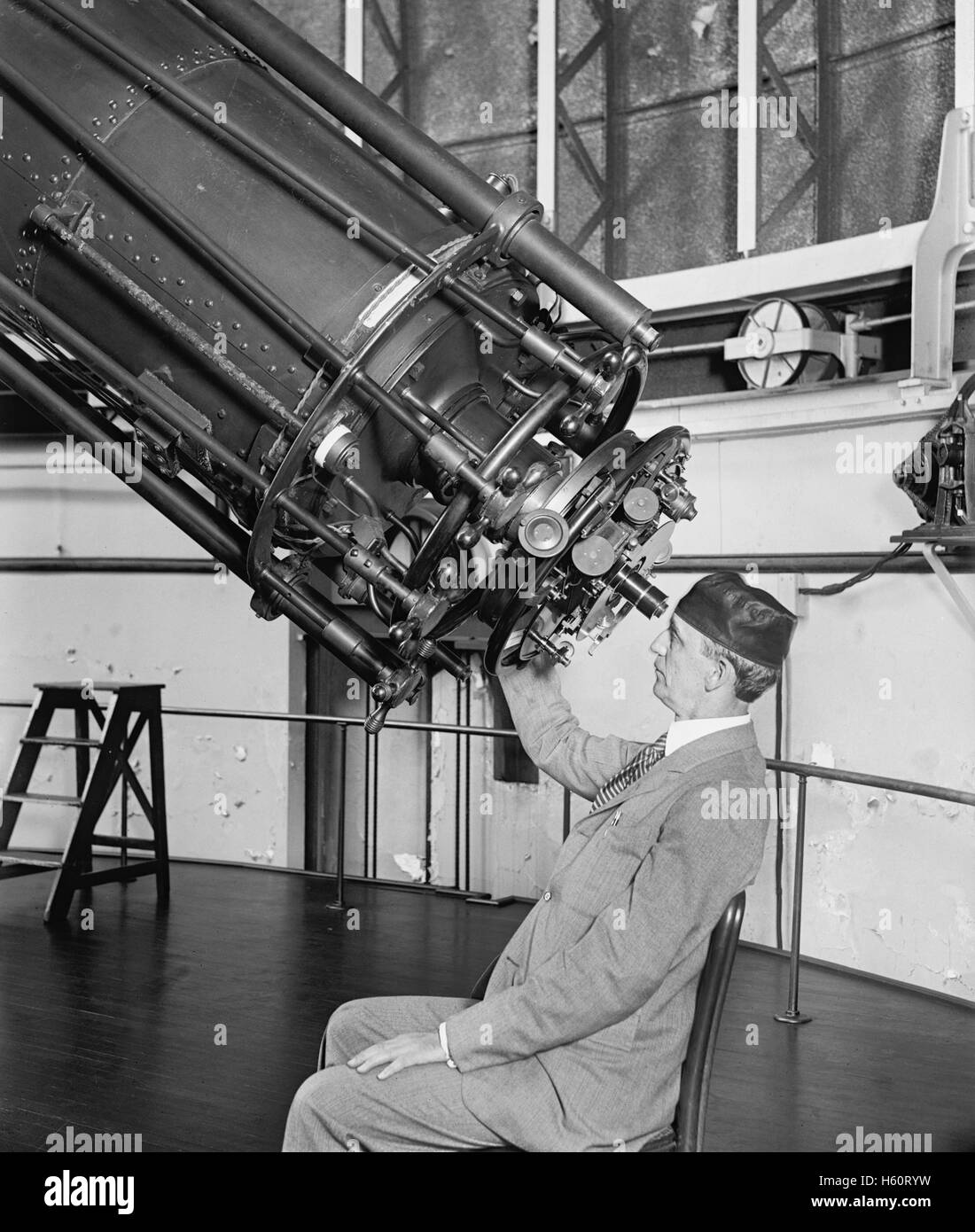 Professor H.E. Burton Looking through Telescope, Close-Up, U.S Naval Observatory, Washington DC, USA, National Photo Company, August 1929 Stock Photo
