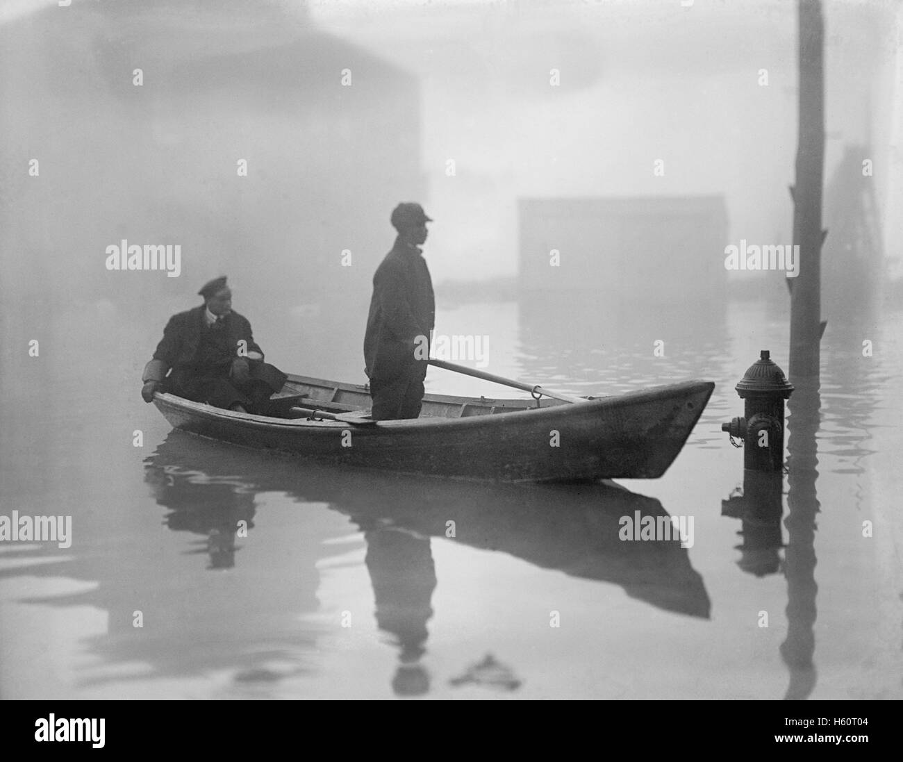 Two Men in Boat after Potomac River Flood, Georgetown, Washington DC, USA, National Photo Company, February 1918 Stock Photo