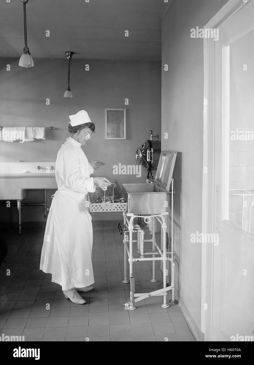 Nurse with Medical Instruments in Hospital, USA, National Photo Company, 1922 Stock Photo