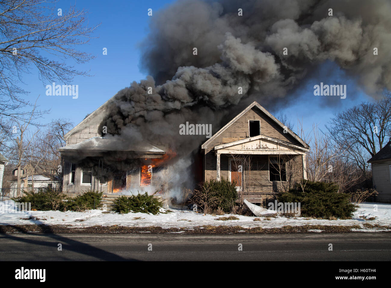Two vacant houses burning, Detroit, Michigan USA Stock Photo