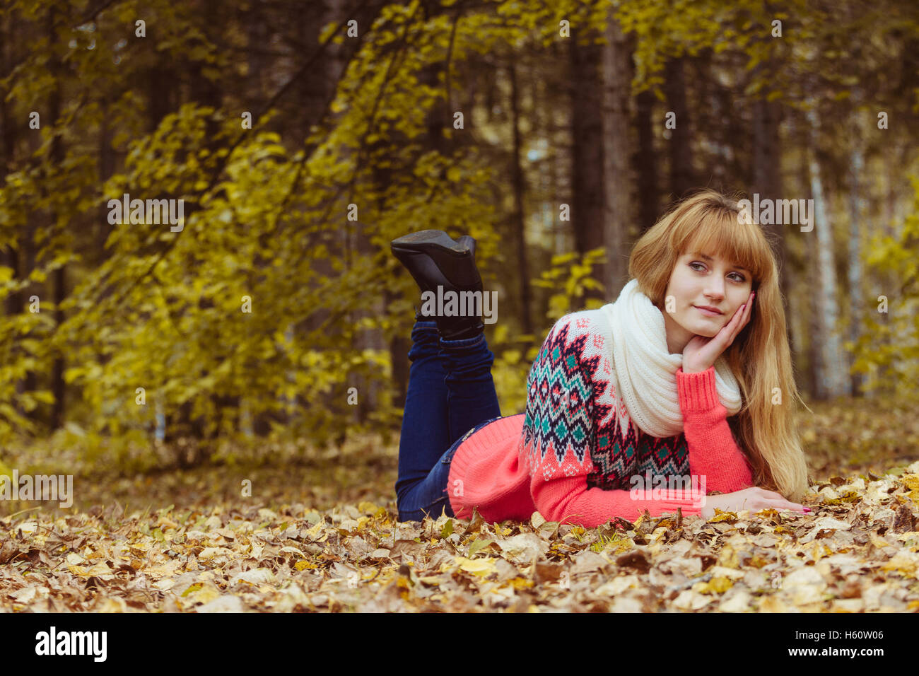 Fall concept - autumn woman laying in park Stock Photo - Alamy