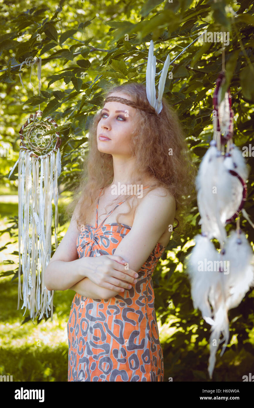 Portrait of Girl with Dreamctahcer Hanging Alongside Stock Photo