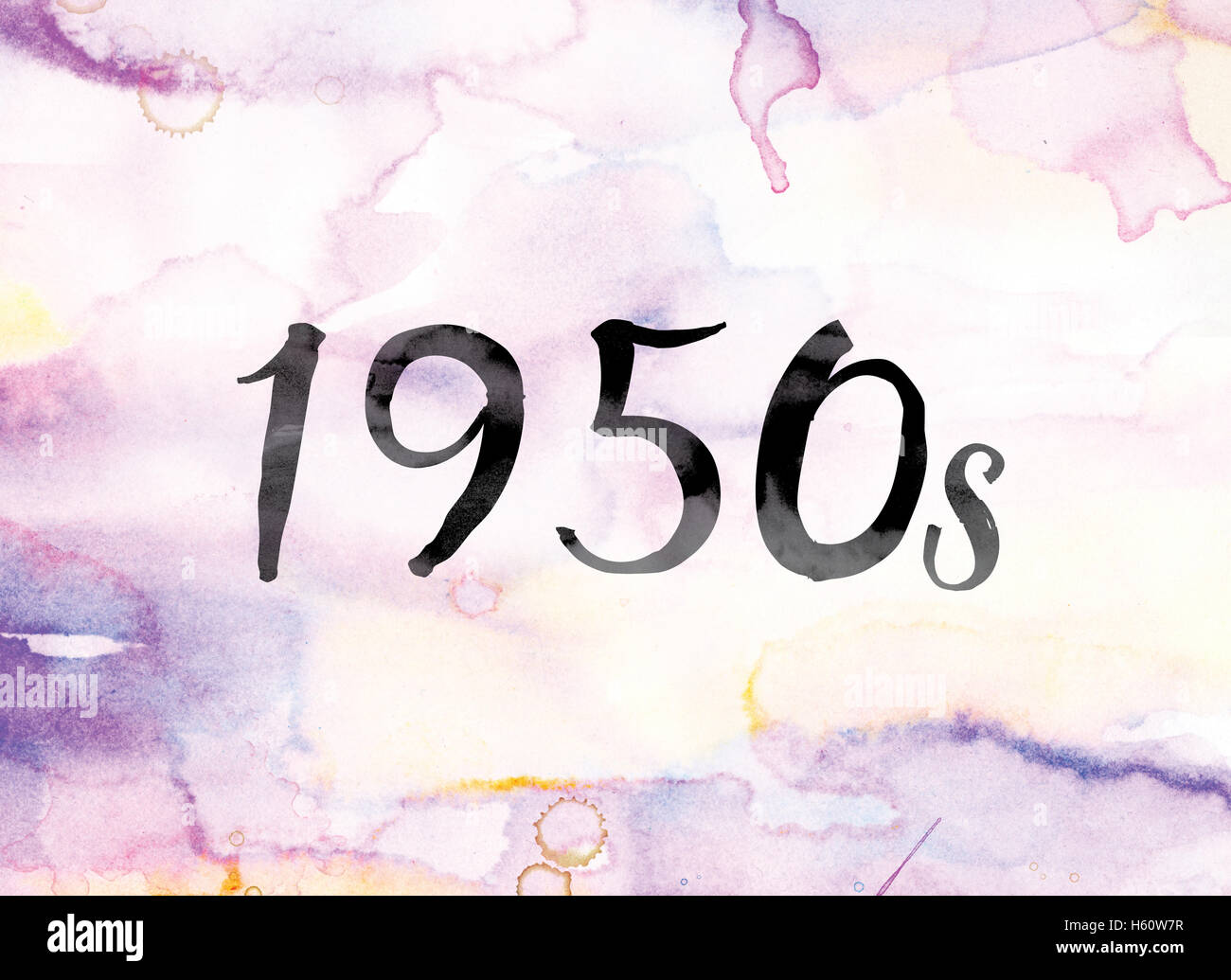 The word '1950s' painted in black ink over a colorful watercolor washed background concept and theme. Stock Photo