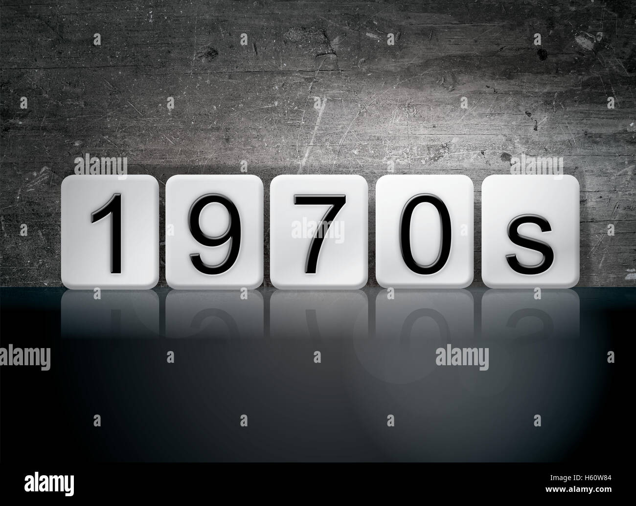 The word '1970s' written in white tiles against a dark vintage grunge background. Stock Photo