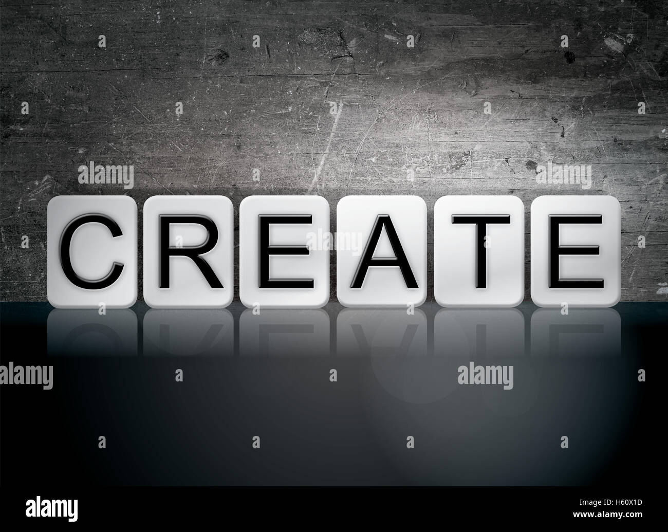 The word "Create" written in white tiles against a dark vintage grunge ...