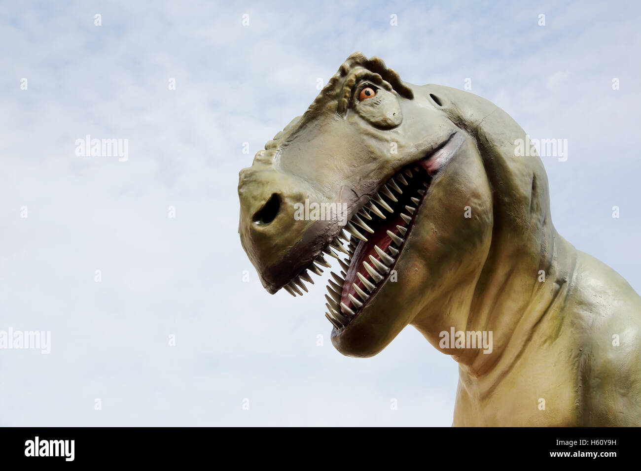 Close up of dinosaur and sky background Stock Photo