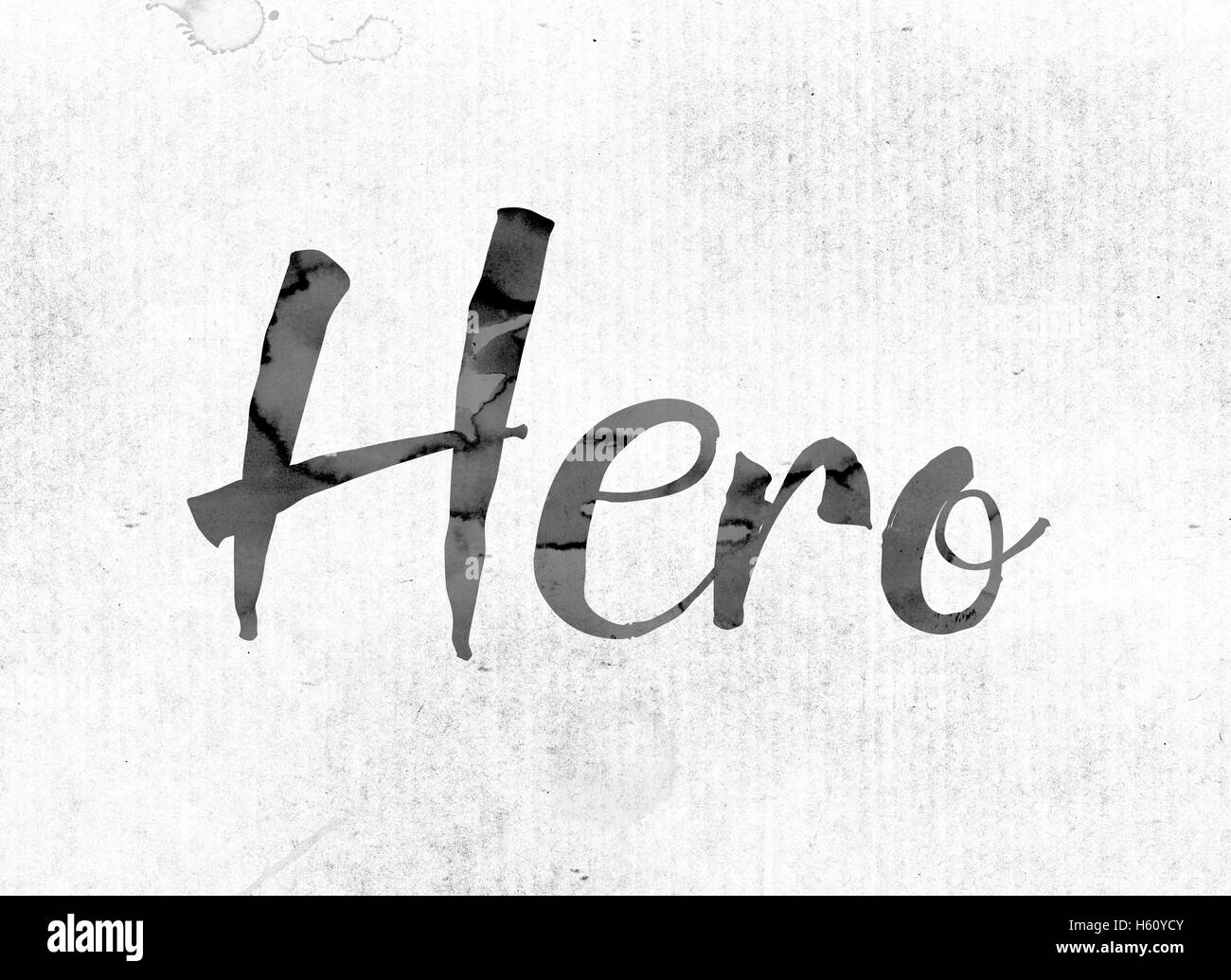 The word 'Hero' concept and theme painted in watercolor ink on a white paper. Stock Photo