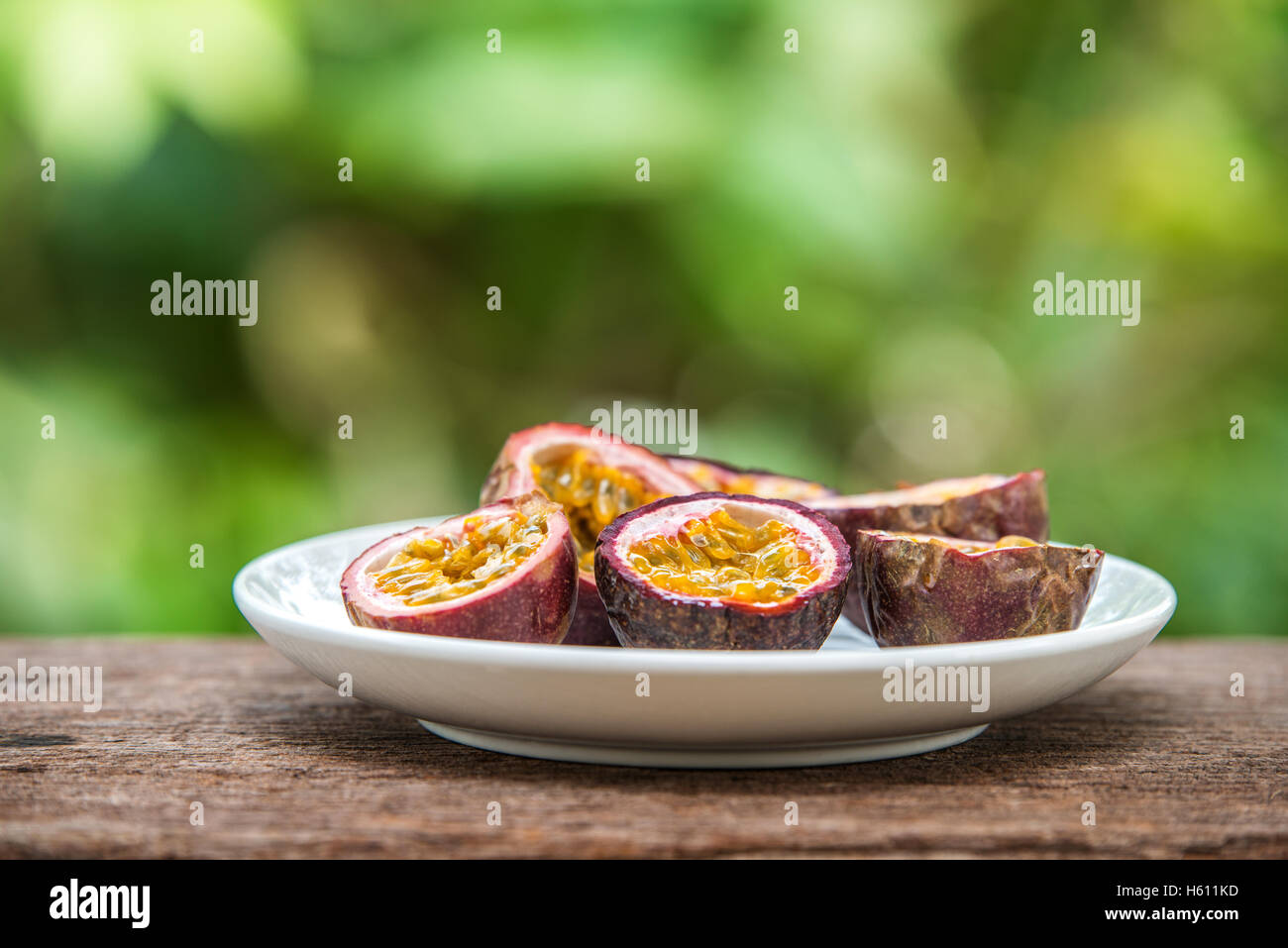 slice passion fruit on dish Stock Photo