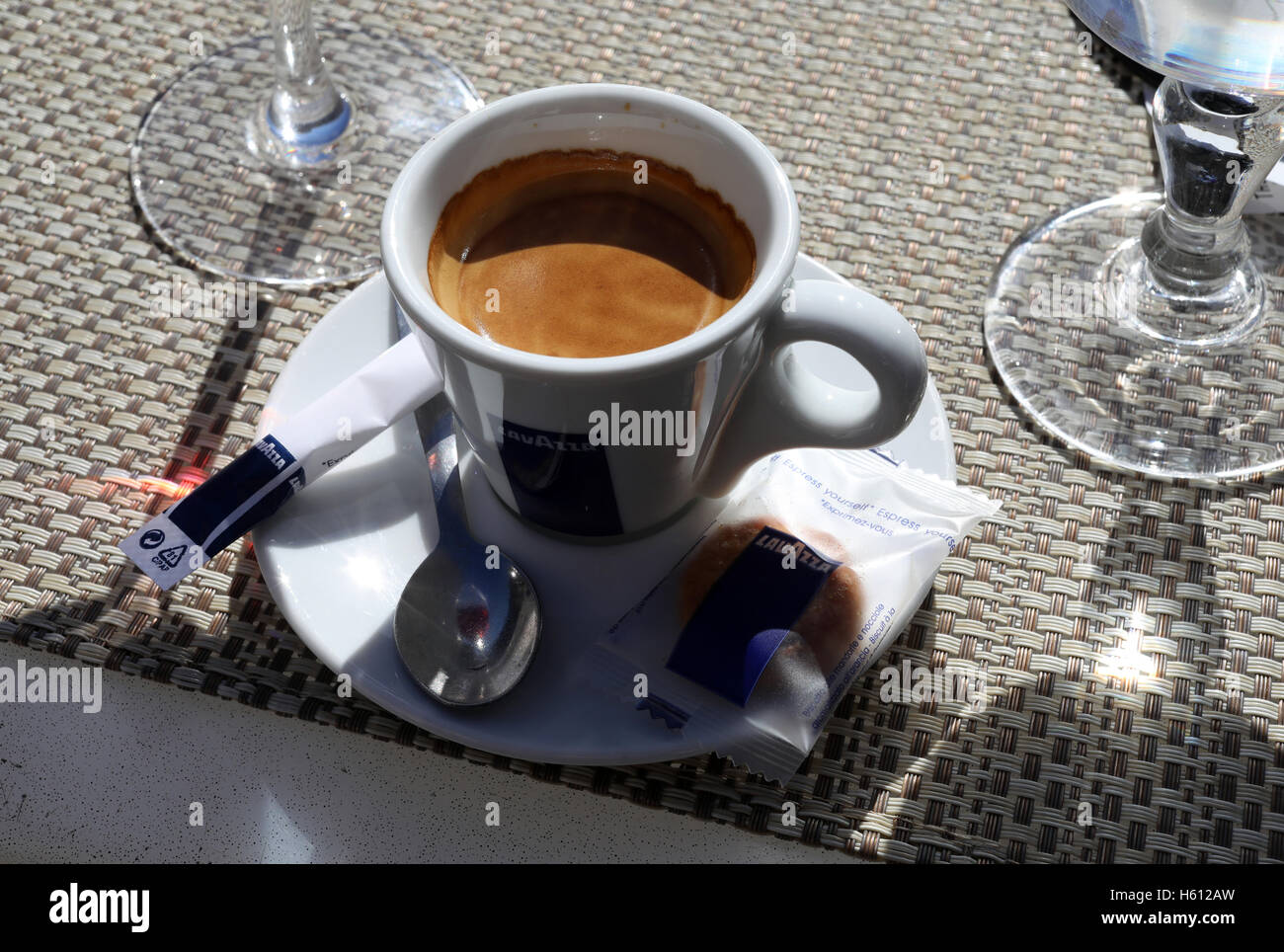 espresso cafe coffee French balck Lavazza branded cup sugar Stock Photo -  Alamy