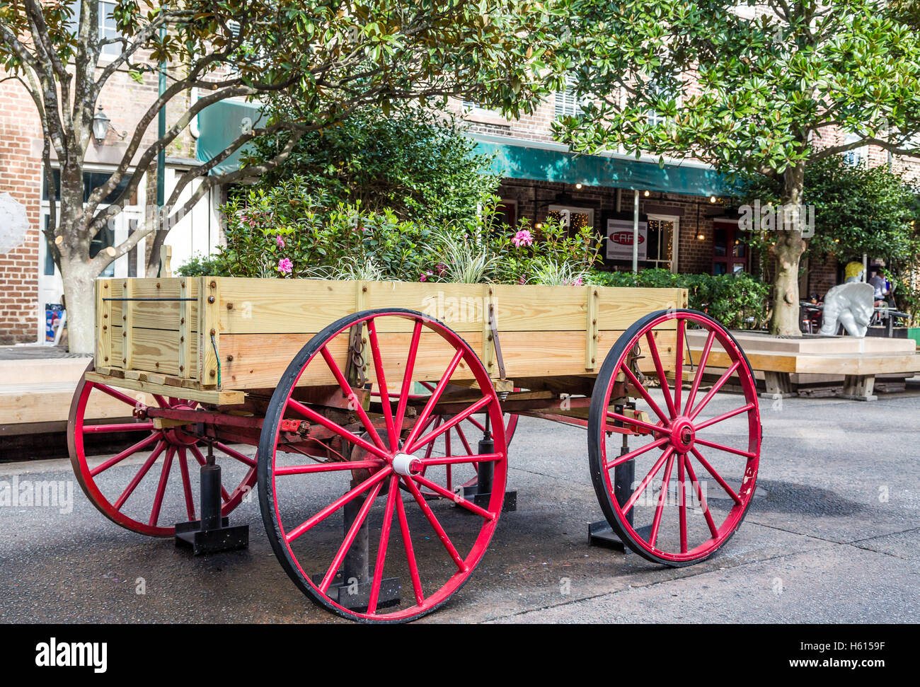 Flowers in Wagon with Red Wheels in Savannah City Market Stock Photo