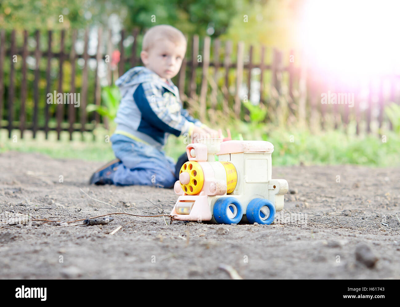 a little boy playing in the toy car in the children's village Stock Photo