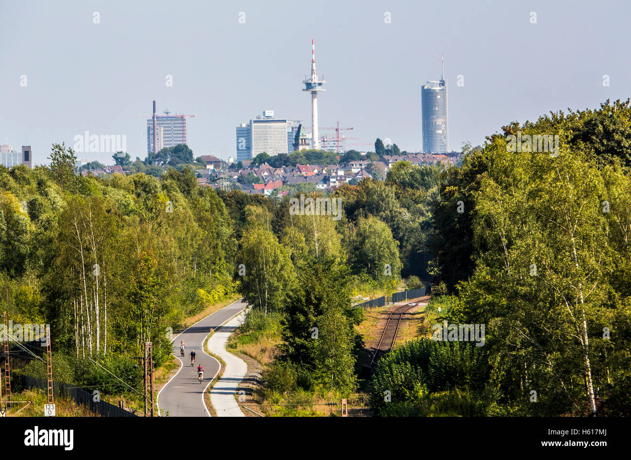Cycle route Rheinische Bahn between Essen and Mülheim, former railway  track, extended to a cycle and walkway, skyline of Essen Stock Photo - Alamy