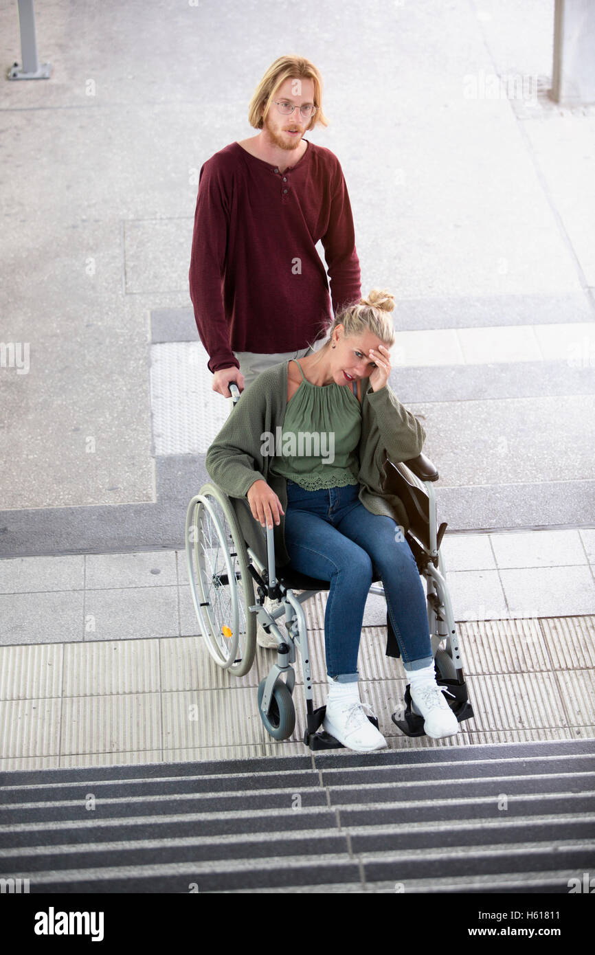 Woman wheelchair stairs hi-res stock photography and images - Alamy