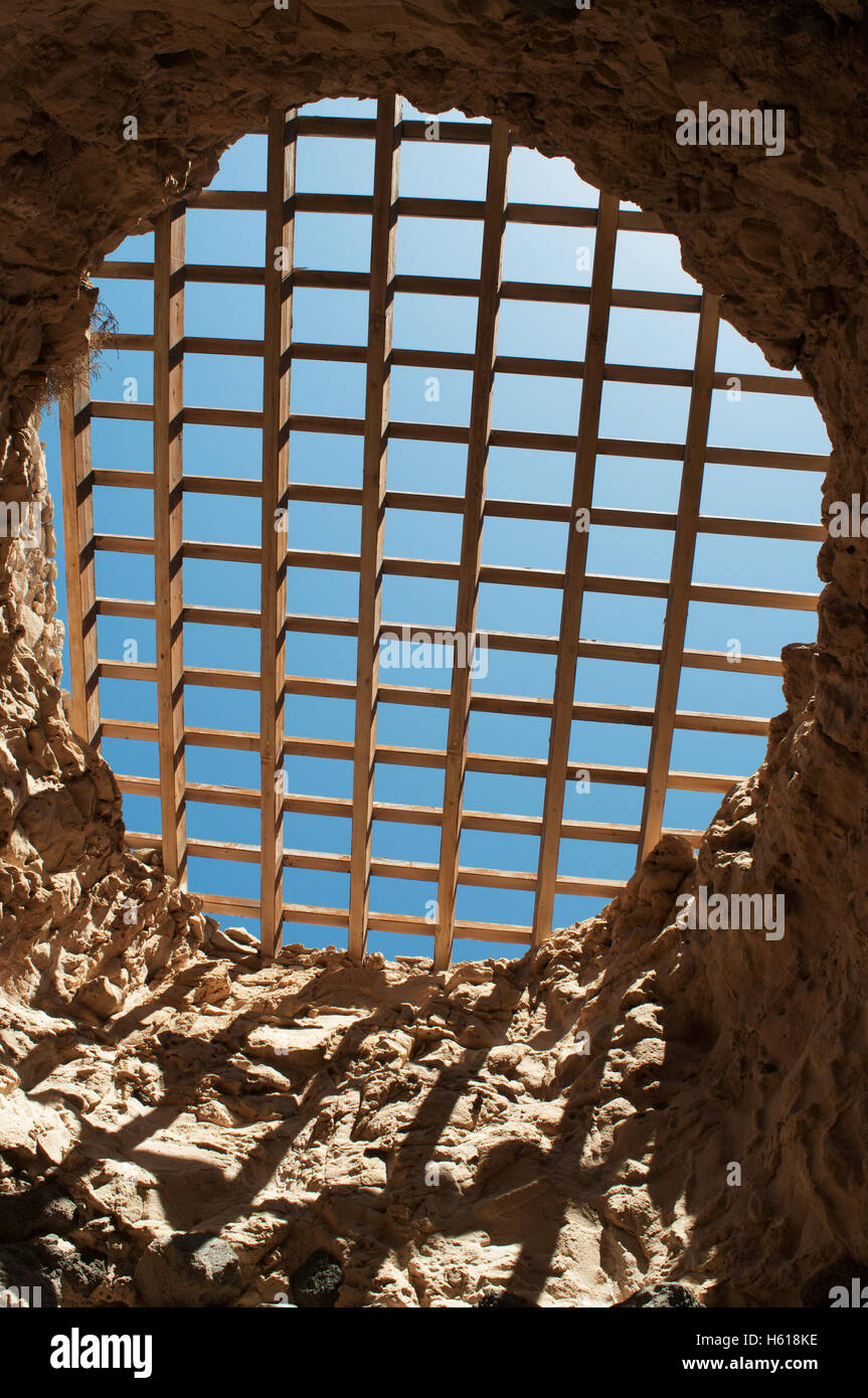 Fuerteventura, Canary Islands, North Africa, Spain: the cover grille of the caves of Ajuy seen from one of the tunnels of the footpath Stock Photo