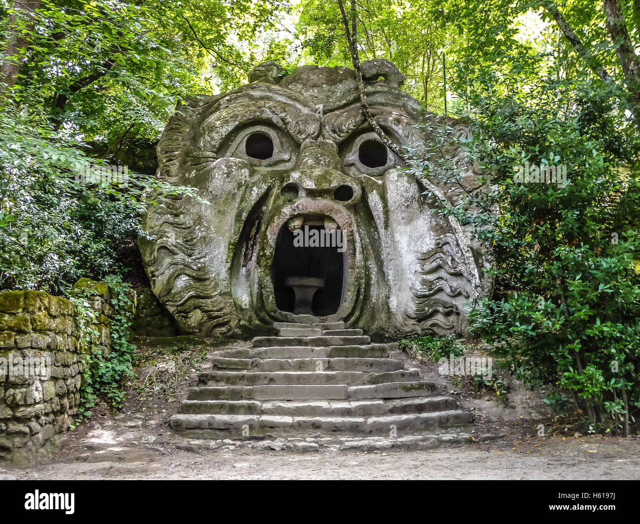 Orcus mouth sculpture at famous Parco dei Mostri (Park of the Monsters), also named Sacro Bosco (Sacred Grove) or Gardens of Bomarzo, Lazio, Italy Stock Photo