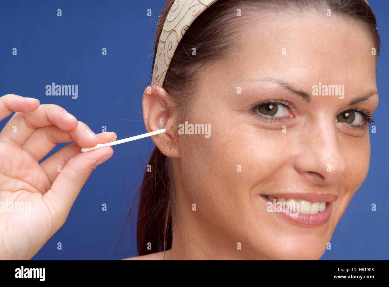 Woman uses cotton bud Stock Photo Alamy