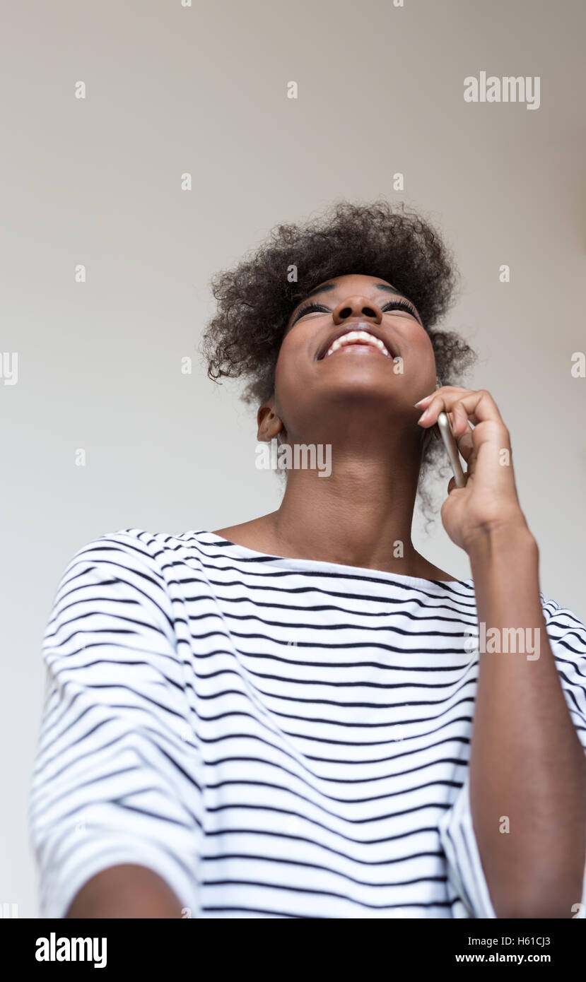 Portrait of a young african american woman at home Stock Photo - Alamy