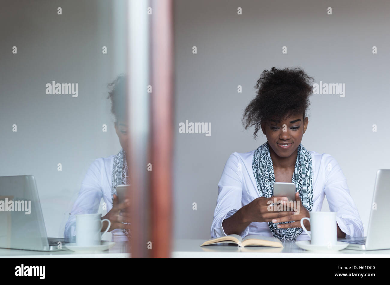 Portrait of a young african american woman at home Stock Photo - Alamy