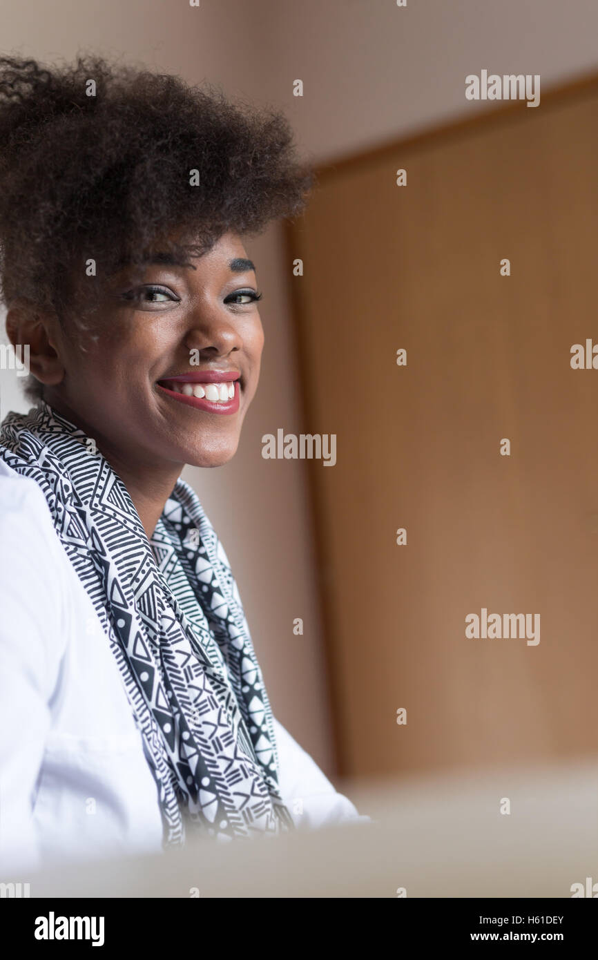 Portrait of a young african american woman at home Stock Photo - Alamy