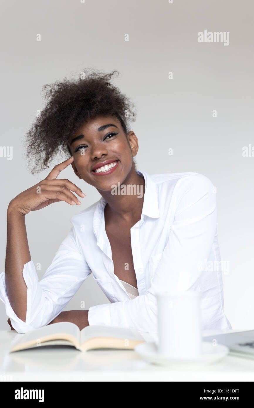 Portrait of a young african american woman at home Stock Photo - Alamy