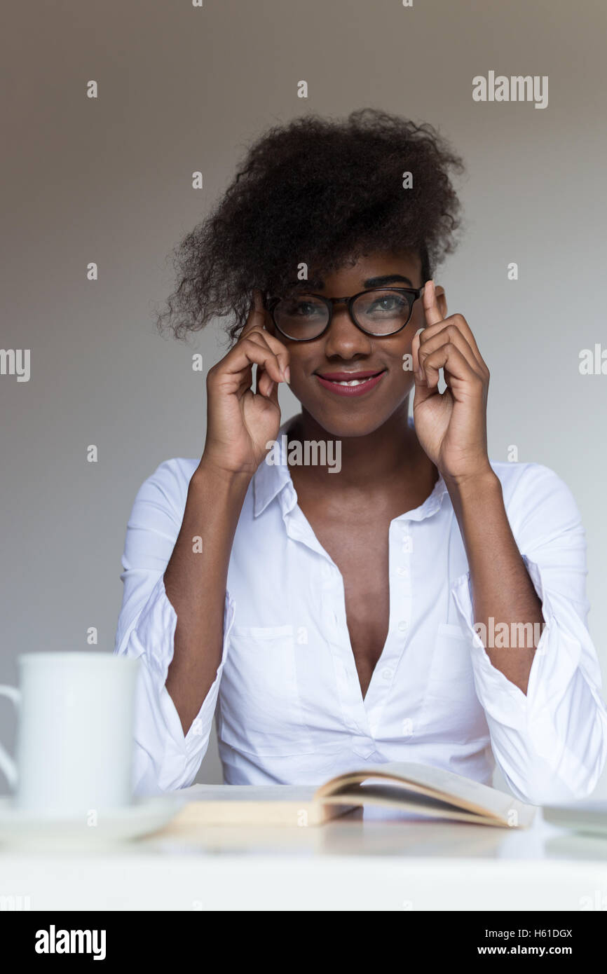 African woman reading a book hi-res stock photography and images - Alamy