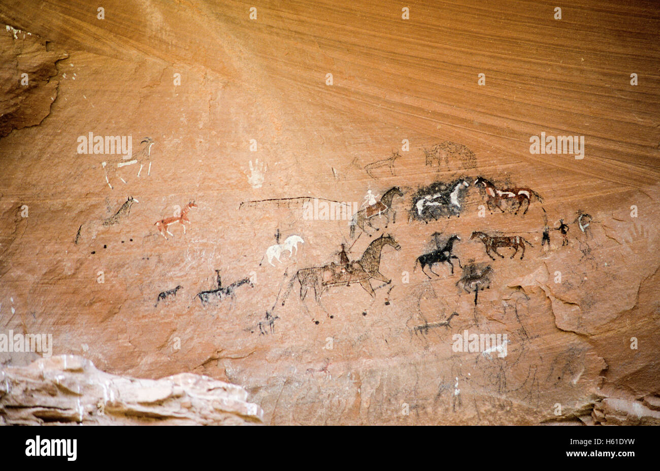 Navajo artist depicted a Ute raid into Navajo country in 1858 on panel in Canyon del Muerto, which is a section of Canyon de Che Stock Photo