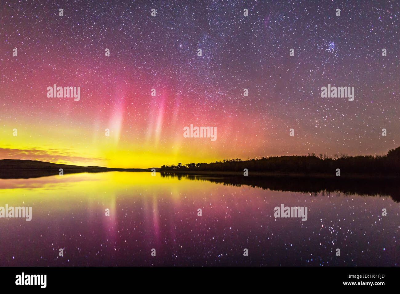 A fairly mild dispay of aurora over the lake at Police Outpost Provincial Park, in southern Alberta, on September 26, 2016, with Stock Photo