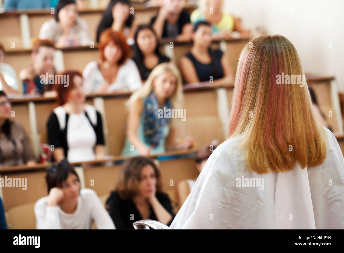 master class in the art of hairdressing, model, and a lot of students