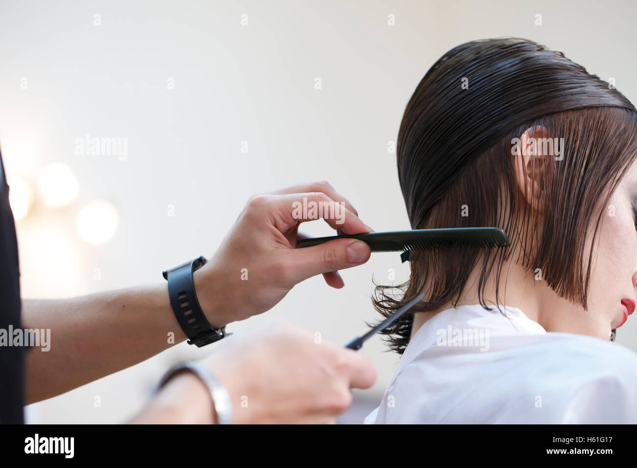 Stylist Hairdresser Doing Haircut Closeup Of Work Equipment The