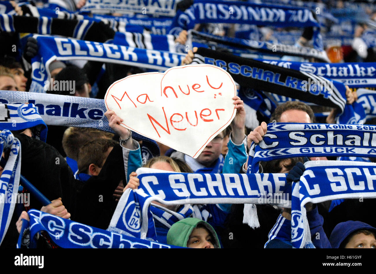 Schalke football club fans with scarves and a Manuel Neuer-heart, German Soccer League, 2009/2010 season, 20th matchday, match Stock Photo
