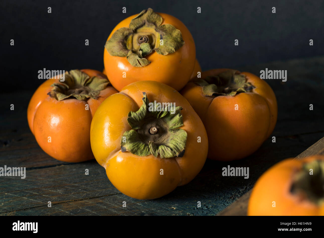 Raw Organic Yellow Persimmons Ready for Cooking Stock Photo Alamy