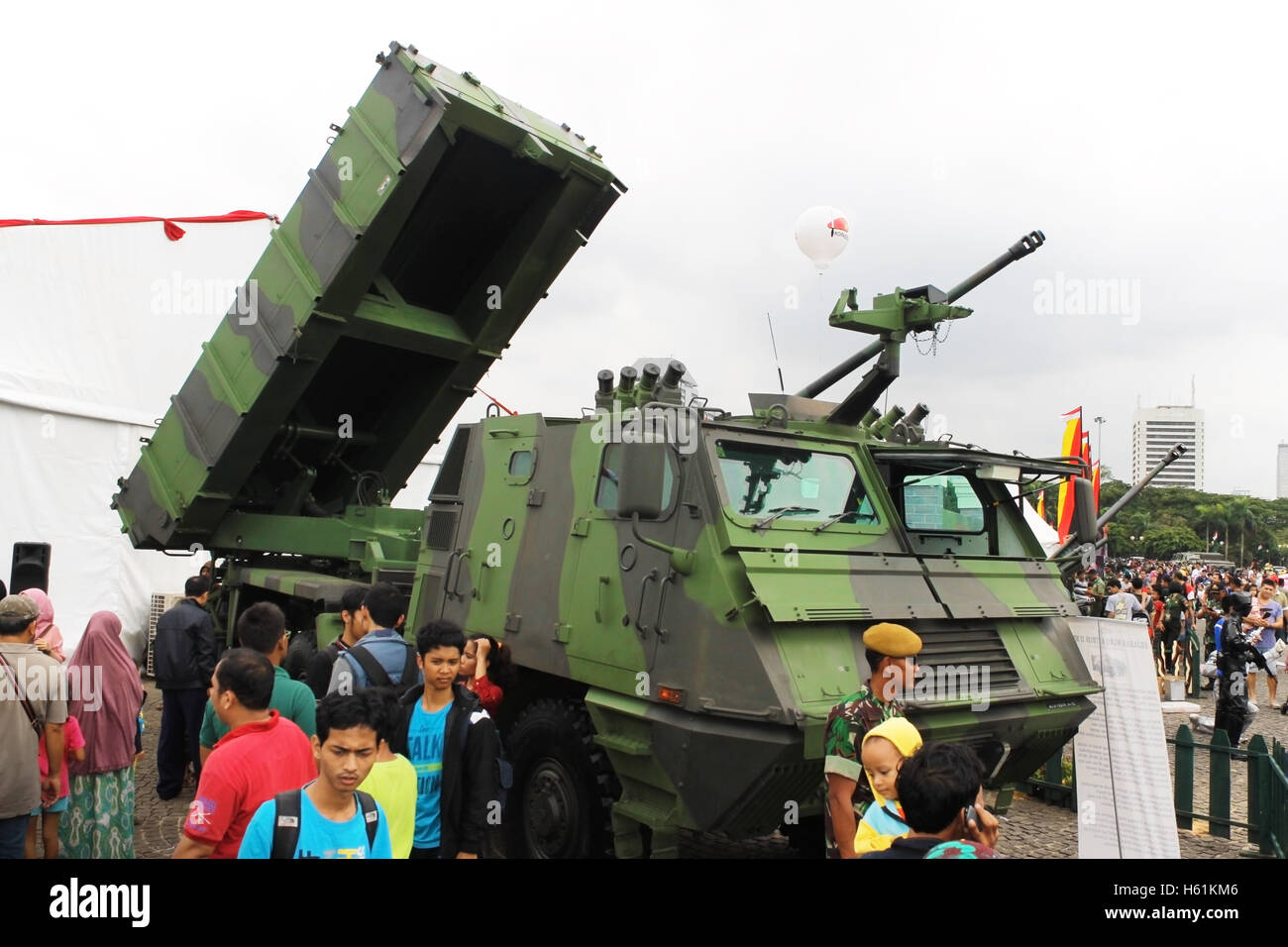 People looking at multiple launcher rocket system vehicle Astros II MK6 in Indonesian Armed Force Exhibition. Stock Photo