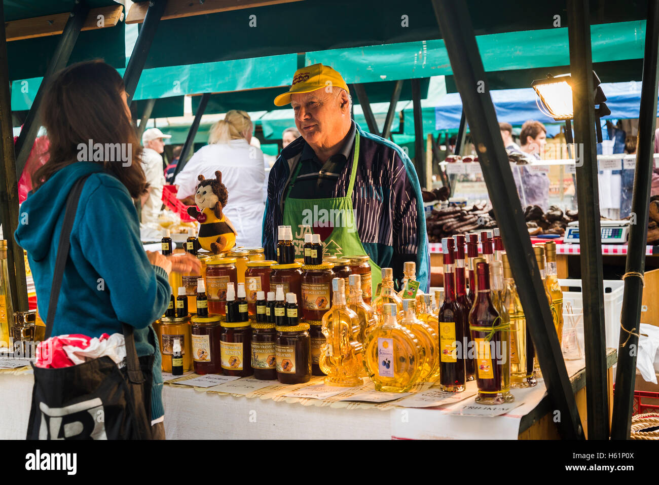 Stall with homemade honey, brandy and liqueur, Producers' artisan market, Ban Jelacic Square, Zagreb, Croatia Stock Photo